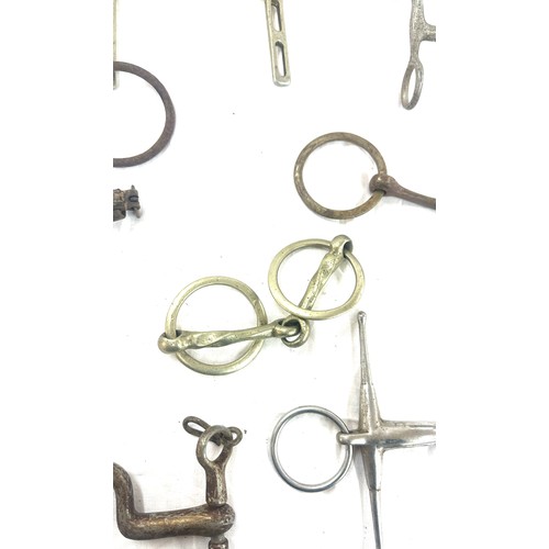 61 - Selection of metal horse bites and two foot rests