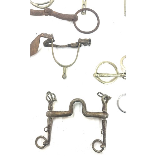 61 - Selection of metal horse bites and two foot rests