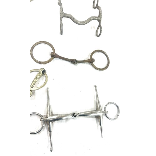 61 - Selection of metal horse bites and two foot rests