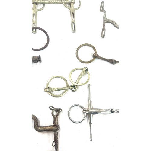 61 - Selection of metal horse bites and two foot rests