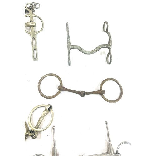 61 - Selection of metal horse bites and two foot rests