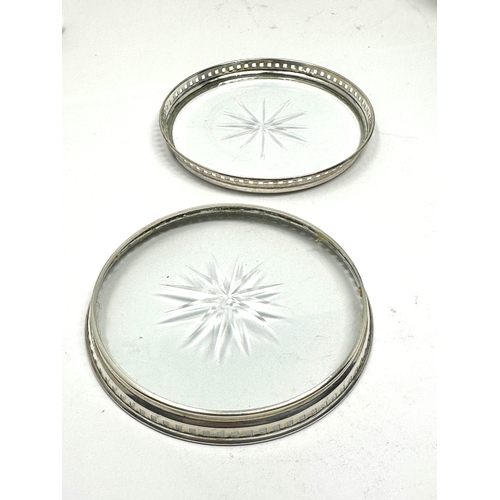 4 - 2 sterling silver rimmed coasters measure approx 8cm dia