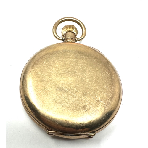 486 - Gold plated open face pocket watch the watch is ticking the case is 20 year guaranteed