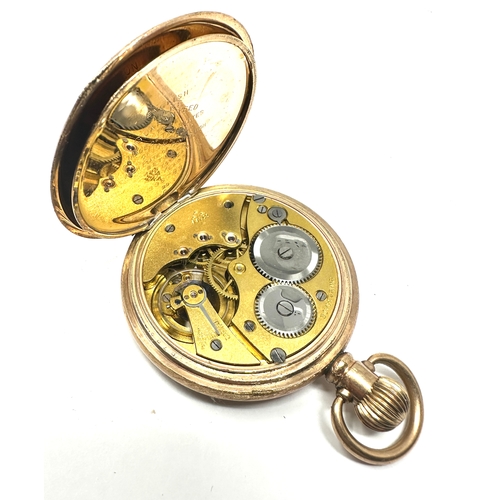 486 - Gold plated open face pocket watch the watch is ticking the case is 20 year guaranteed