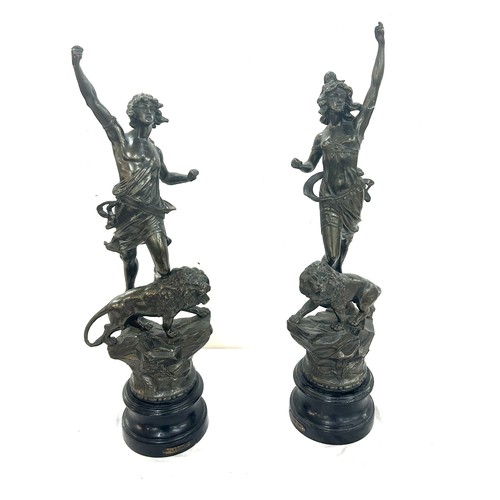 74 - Pair of spelter figures ' La Force' and ' Le Pouvoir' standing on lions - AF , Overall height approx... 