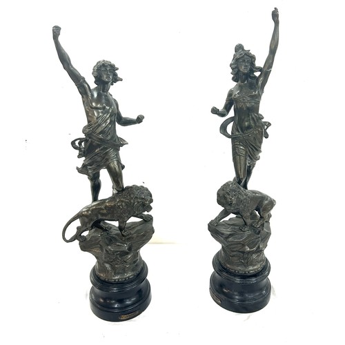 74 - Pair of spelter figures ' La Force' and ' Le Pouvoir' standing on lions - AF , Overall height approx... 