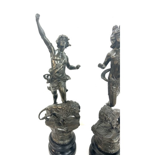 74 - Pair of spelter figures ' La Force' and ' Le Pouvoir' standing on lions - AF , Overall height approx... 