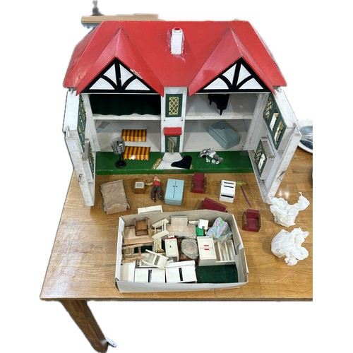 234 - Circa 1930a Triang Dolls house with later 50s/70s furniture