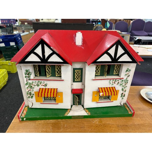 234 - Circa 1930a Triang Dolls house with later 50s/70s furniture