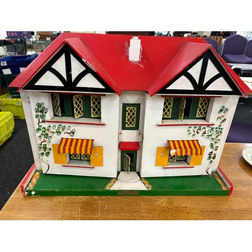 234 - Circa 1930a Triang Dolls house with later 50s/70s furniture