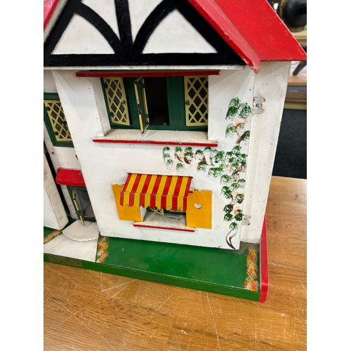 234 - Circa 1930a Triang Dolls house with later 50s/70s furniture