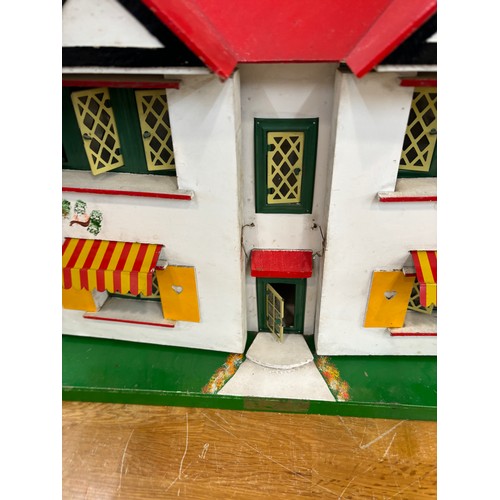 234 - Circa 1930a Triang Dolls house with later 50s/70s furniture