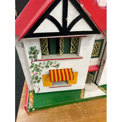 234 - Circa 1930a Triang Dolls house with later 50s/70s furniture