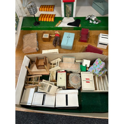 234 - Circa 1930a Triang Dolls house with later 50s/70s furniture