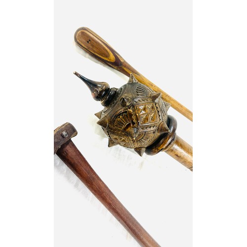 289 - Ceremonial carved wood club, throwing club and a coconut cutting tool