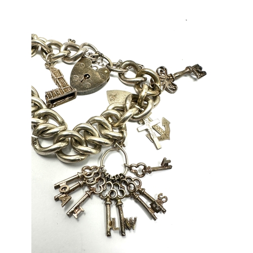 242 - Vintage silver charm bracelet & charms weight 53g