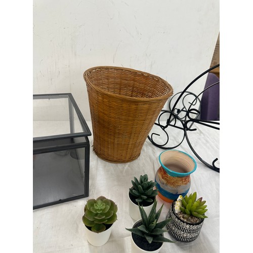 251 - Selection of home ware items to include faux plants, wicker basket, plant stand etc