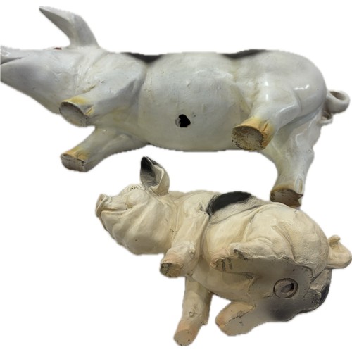 288 - 2 resin pig ornaments, largest measures approximately: Length 24 inches, Width 8 inches