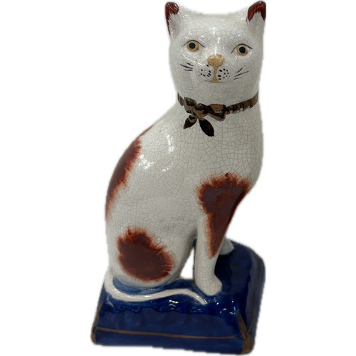 522 - Pair Staffordshire cats, blue and gilt cushion type bases, approximate height 20cm