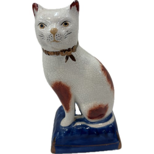 522 - Pair Staffordshire cats, blue and gilt cushion type bases, approximate height 20cm