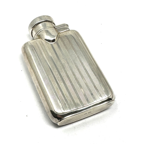 24 - Antique silver hip flask measures approx 8cm by 4.5cm