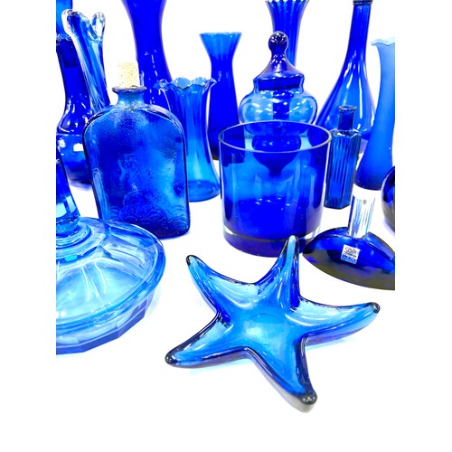 123 - Selection of blue glass vases, trinkets, bottles etc, tallest piece measures approximately 11 inches