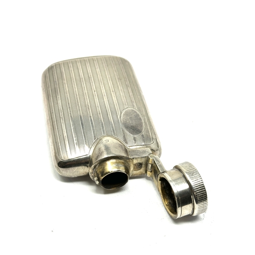 24 - Antique silver hip flask measures approx 8cm by 4.5cm