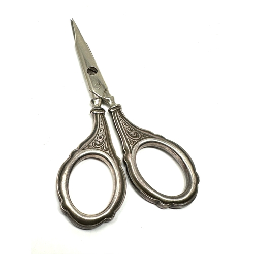 31 - Antique silver handle sewing scissors measure approx 9.5cm long in good condition