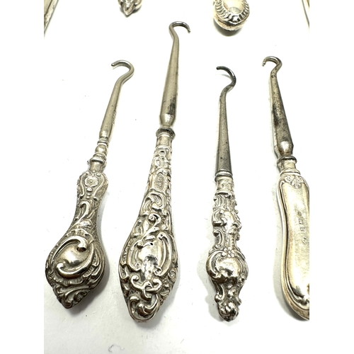 44 - 8 Antique silver handle button hooks