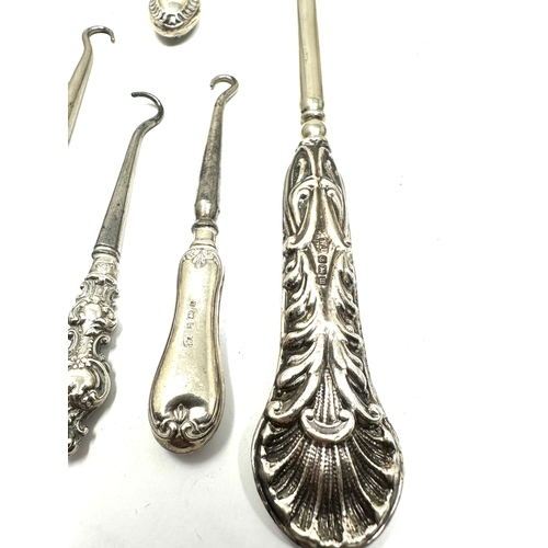 44 - 8 Antique silver handle button hooks