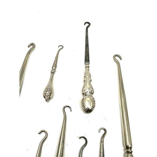 44 - 8 Antique silver handle button hooks