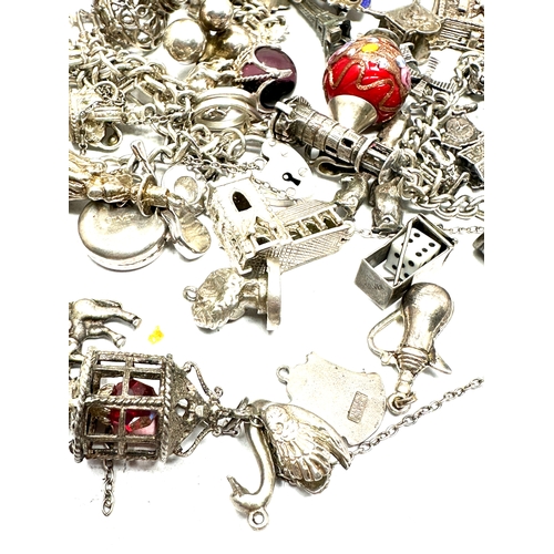 260 - Large selection of vintage silver charm bracelets and loose charms weight 228g