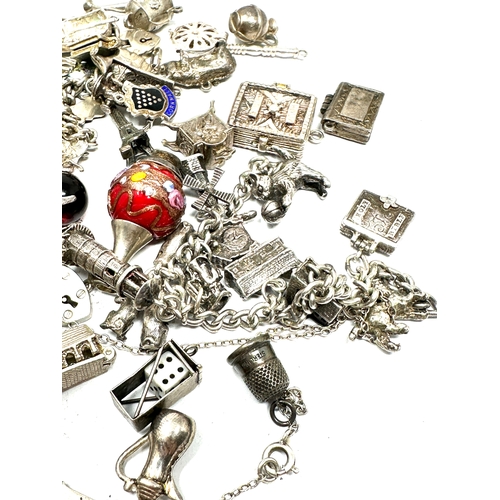 260 - Large selection of vintage silver charm bracelets and loose charms weight 228g