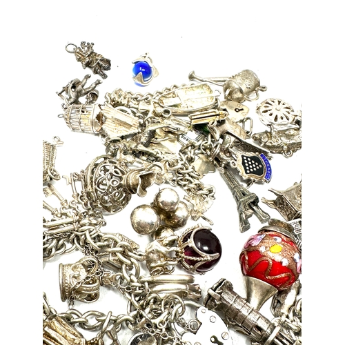 260 - Large selection of vintage silver charm bracelets and loose charms weight 228g