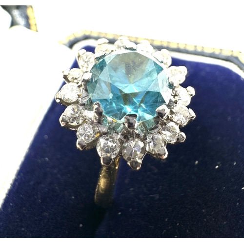 141 - 18ct gold diamond & blue zircon ring weight 6.6g