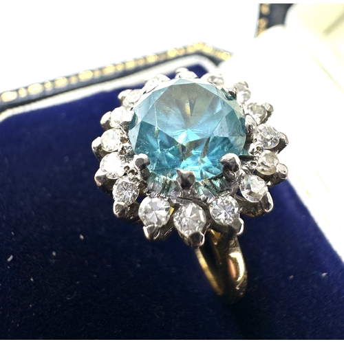 141 - 18ct gold diamond & blue zircon ring weight 6.6g