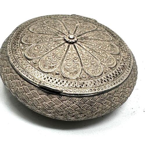 49 - antique ornate asian / eastern silver pill / snuff box measures approx 5.5cm dia xrt tested as silve... 