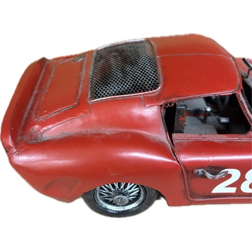 94 - Tin plate Ferrari  model car, approximate measurements: 14 inches in length