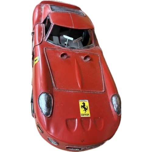 94 - Tin plate Ferrari  model car, approximate measurements: 14 inches in length