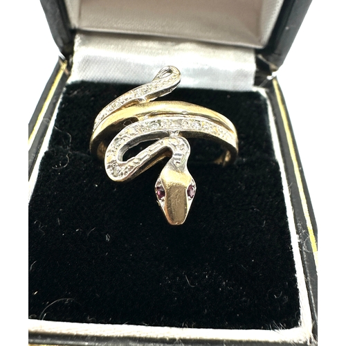 134 - 9ct gold diamond snake ring ruby eyes weight 2.6g