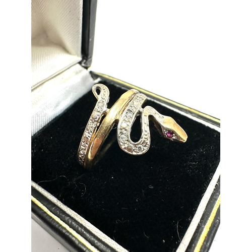 134 - 9ct gold diamond snake ring ruby eyes weight 2.6g