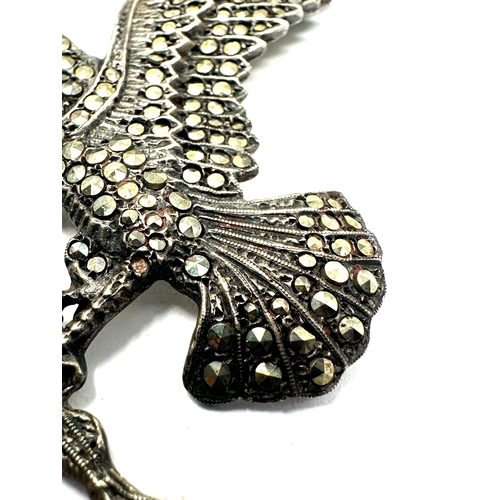 224 - Large silver & marcasite eagle brooch measures approx 7.5cm by 5cm red gem eyes missing 2 marcasite ... 