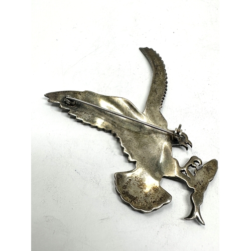 224 - Large silver & marcasite eagle brooch measures approx 7.5cm by 5cm red gem eyes missing 2 marcasite ... 