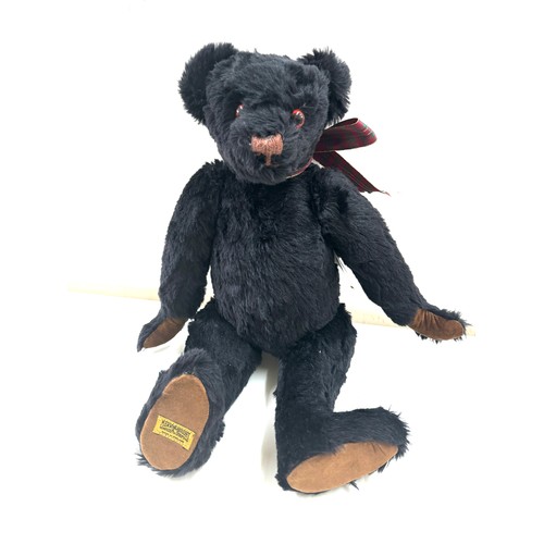 57 - Large black merrythought bear label to foot, approximately 50cm tall