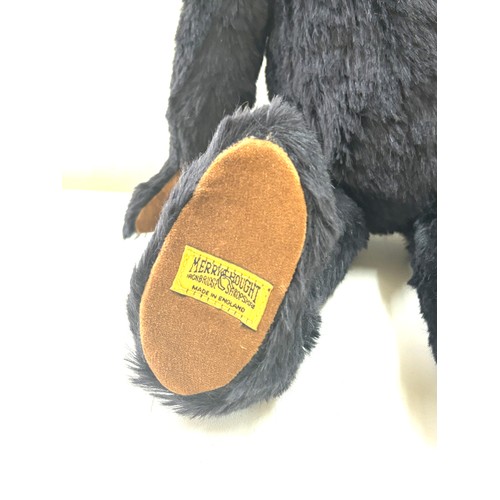 57 - Large black merrythought bear label to foot, approximately 50cm tall