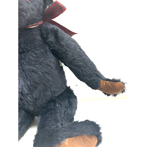 57 - Large black merrythought bear label to foot, approximately 50cm tall