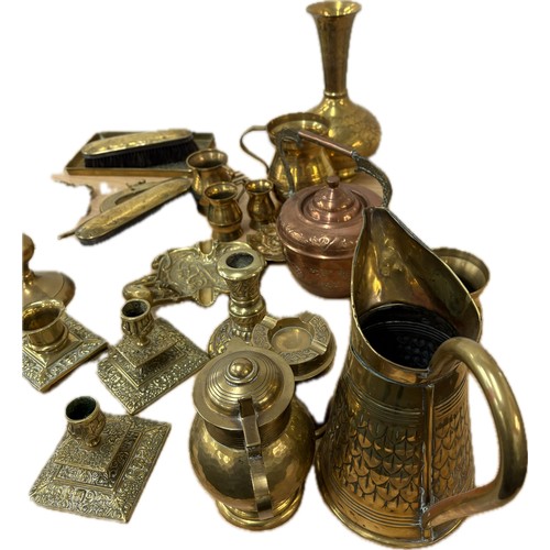 115 - Large selection of brassware to include candlesticks, jugs, plaques, vases, ornaments, small copper ... 