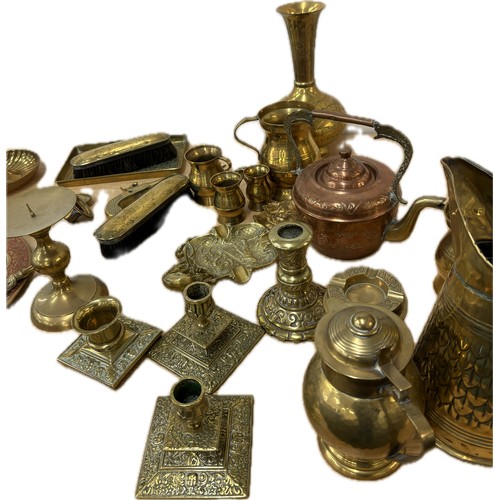 115 - Large selection of brassware to include candlesticks, jugs, plaques, vases, ornaments, small copper ... 