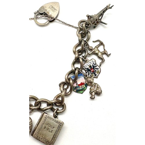 450 - Vintage silver charm bracelet, total approximate weight 58g