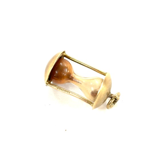 456 - 9ct gold hour glass charm , approximate weight 1.6g